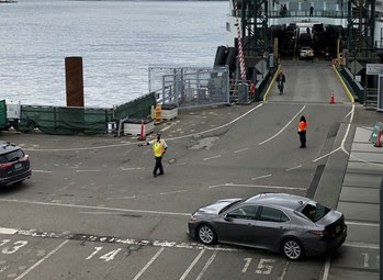 Photo of terminal employees directing traffic at Colman Dock