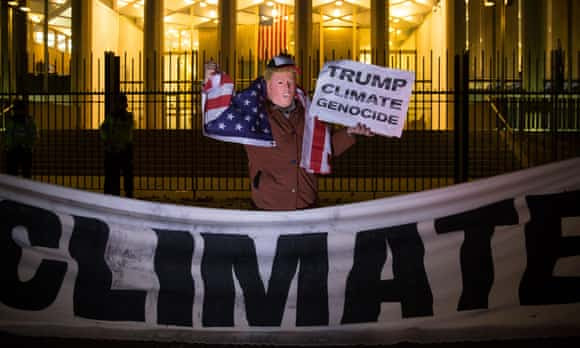 A man wearing a Donald Trump mask protests outside the US embassy in London.