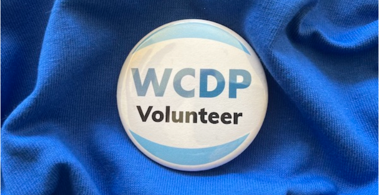 WCDP Volunteer button on a blue background