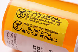 Photo: prescription drug bottle with a warning label that says, 