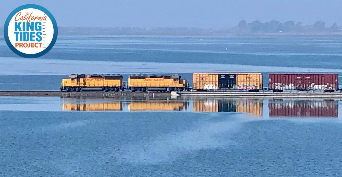Train passes over flooded wetlands during king tide