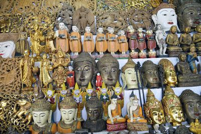 Rows of Buddhas statues and heads at display
