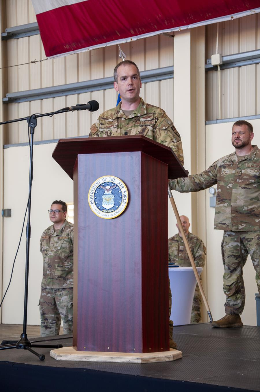 Lt Col David C. Gorman standing behind podium