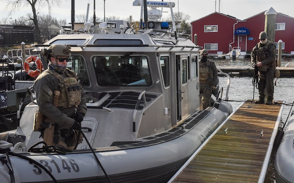  Crewmembers from Maritime Security Response Team-East, located in Chesapeake, Va., prepare to get underway for security operations ahead of the 2021 Presidential Inauguration at Joint Base Anacostia-Bolling, Washington, Jan. 16, 2021. On Sept. 24, 2018, the Department of Homeland Security designated the Presidential Inauguration as a recurring National Special Security Event. Events may be designated NSSEs when they warrant the full protection, incident management and counterterrorism capabilities of the Federal Government. (U.S. Coast Guard photo by Petty Officer 3rd Class Kimberly Reaves/Released) 