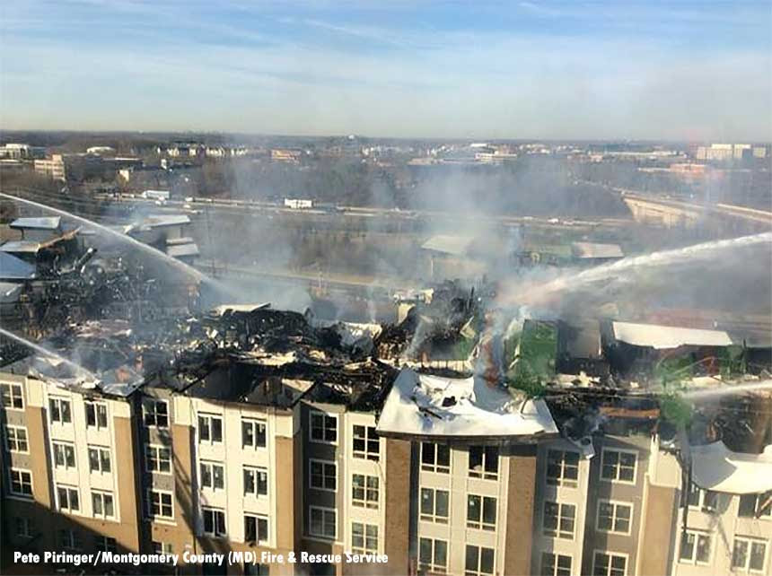 Firefighters use multiple elevated streams during a fire in Rockville, Maryland.