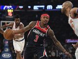 Washington Wizards guard Bradley Beal (3) dribbles the ball as New York Knicks center Taj Gibson (67) defends during the first half of an NBA basketball game, Wednesday, Feb. 12, 2020, in New York. (AP Photo/Sarah Stier)
