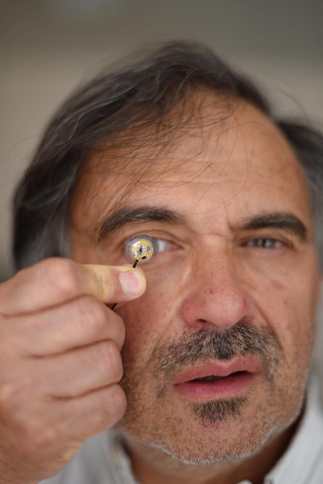 Professor Jean-Louis de Bougrenet de la Tocnaye with his battery-packing contact lens
