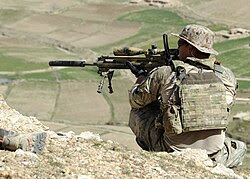 A coalition Special Operations Forces member fires his sniper rifle from a hilltop during a firefight near Nawa Garay village (120403-N-MY805-202).jpg