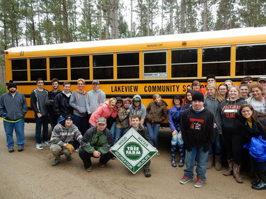 Students from Lakeview Community Schools pose for a photo after visiting their school forest.