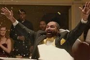 Steelers fullback Franco Harris bursts from a cake in the Wix commercial to be viewed during the Super Bowl.