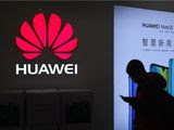 In this Dec. 11, 2018, file photo, a man browses his smartphone outside a Huawei store at a shopping mall in Beijing. Sen. Tom Cotton, Arkansas Republican, has introduced legislation preventing intelligence sharing with countries that permit Huawei to operate 5G networks. (AP Photo/Andy Wong) **FILE**