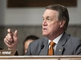 FILE - In this Dec. 3, 2019, file photo, Sen. David Perdue, R-Ga., speaks during a hearing of the Senate Armed Services Committee in Washington. The Democratic candidates vying to take on Perdue in November square off in a primary election Tuesday, June 9, after weeks of delay caused by the coronavirus pandemic. (AP Photo/Alex Brandon, File)