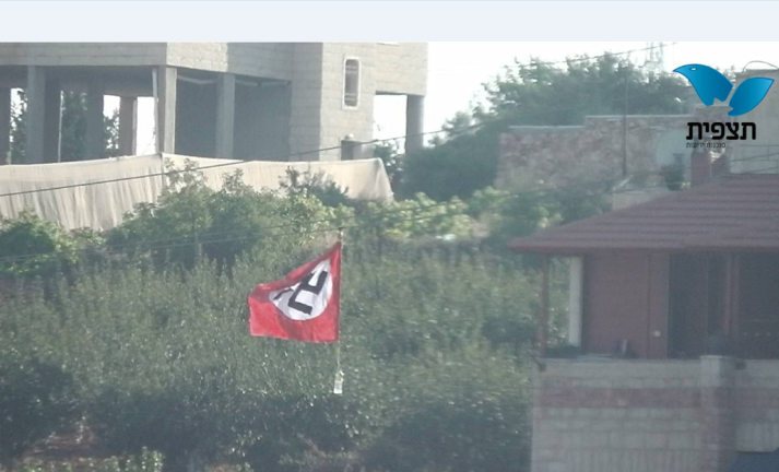 Nazi swastika flag on the outskirts of Bayt Umar (picture by Avraham Weiss for Tazpit News Agency, July 6, 2014).
