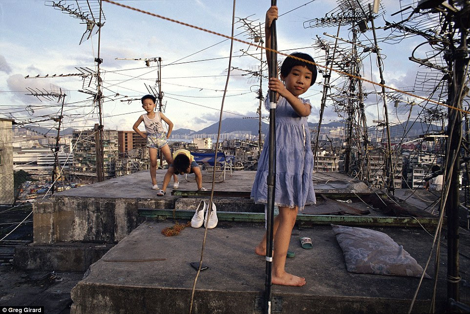 Families with young children, who played on top of apartment buildings, lived among gang members and drug addicts in the slum