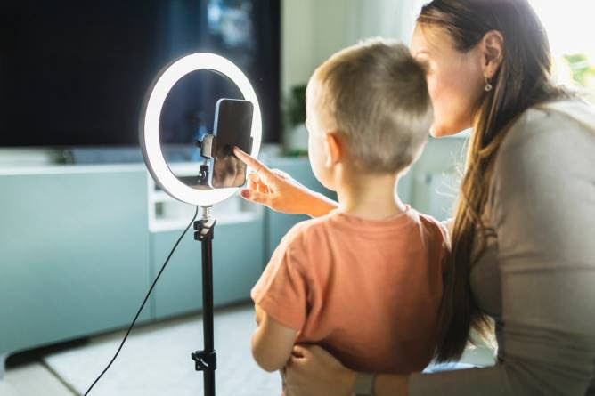 A child in front of a ring light