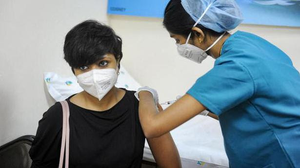  A medical worker inoculates a young woman with a dose of the corona vaccine at a vaccination centre during the first day of India's vaccination drive to all adults amid coronavirus second wave pandemic in Bengaluru, Saturday, May 1, 2021. 