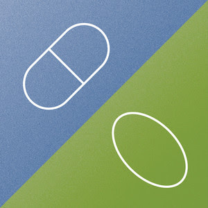 Two pills on blue and green background. 