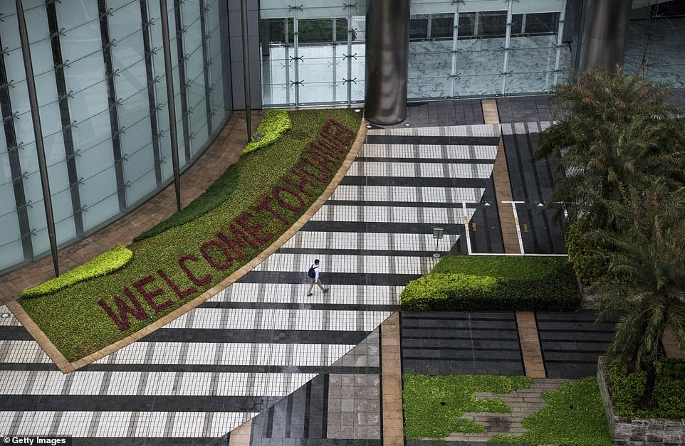 A garden with 'Welcome to Huawei' spelled out in flowers is seen outside one of the office buildings in the complex