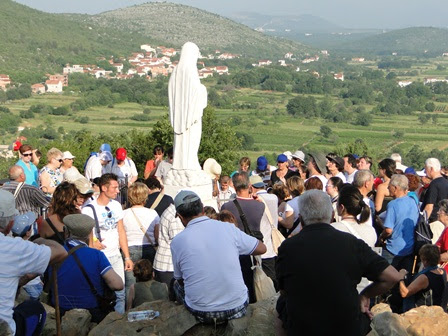 people on Apparition Hill near Our Lady's statue