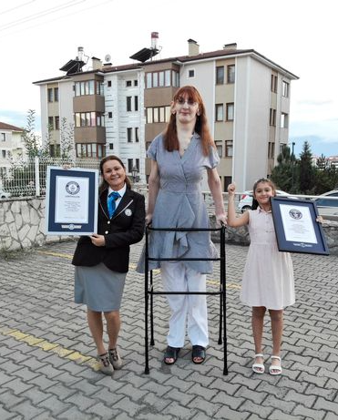 Guinness World Records crowns 24-year-old woman over 7ft as