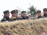 In this Friday, March 20, 2020, photo provided by the North Korean government, North Korean leader Kim Jong Un supervises an artillery firing competition between army units in the country&#39;s west in North Korea. Independent journalists were not given access to cover the event depicted in this image distributed by the North Korean government. The content of this image is as provided and cannot be independently verified. Korean language watermark on image as provided by source reads: &amp;quot;KCNA&amp;quot; which is the abbreviation for Korean Central News Agency. (Korean Central News Agency/Korea News Service via AP)