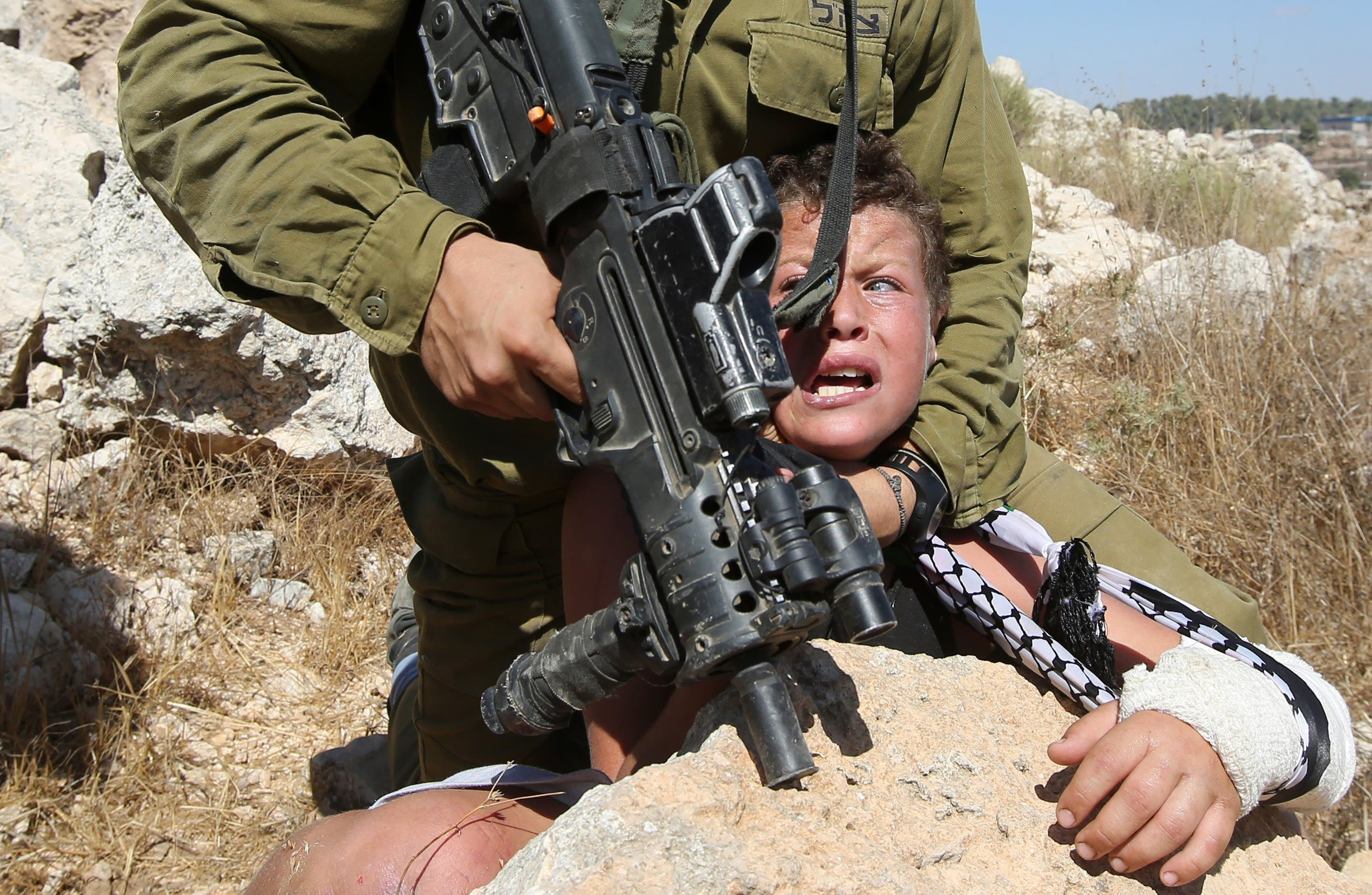 Images show Israeli soldier handling Palestinian boy | CNN