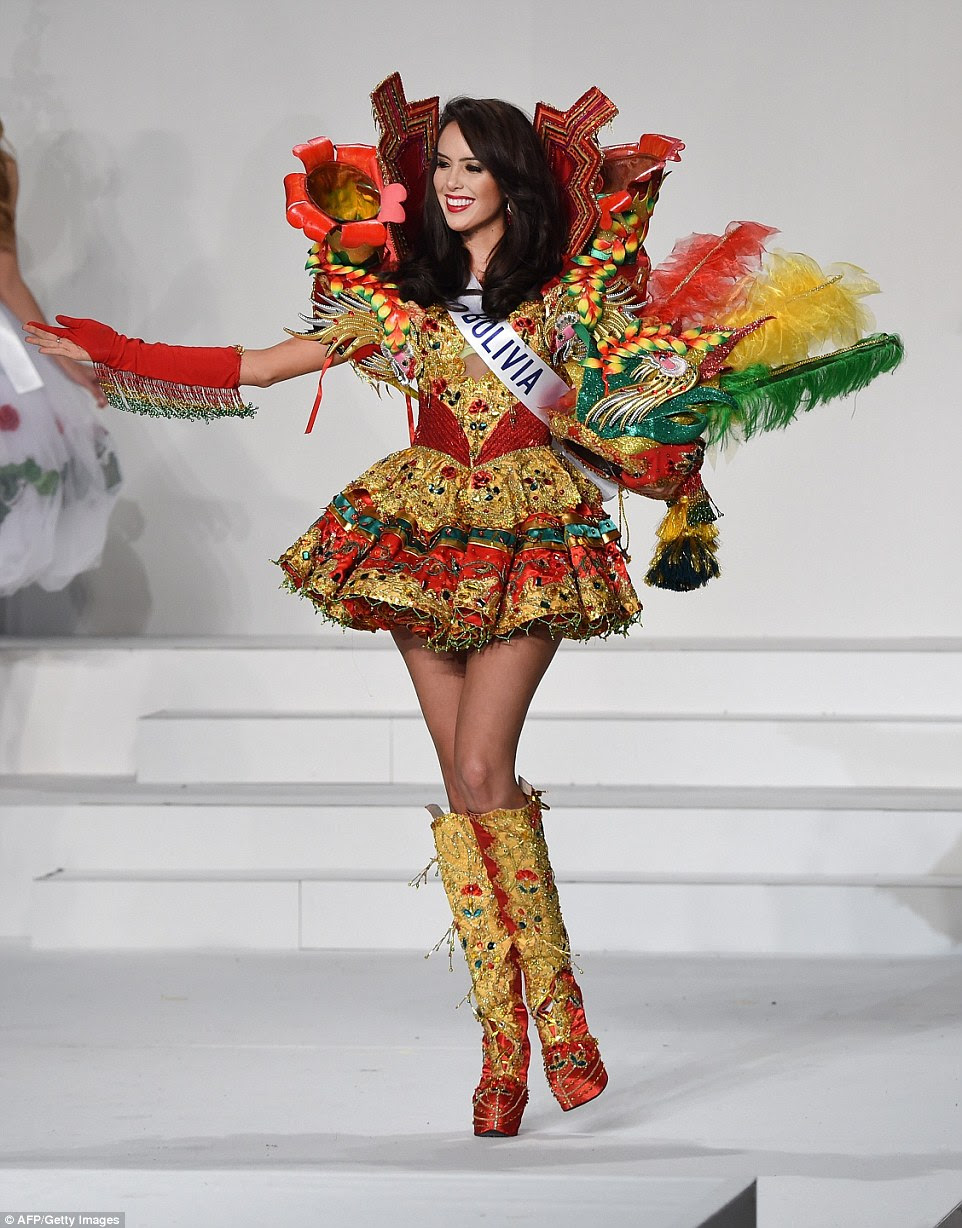 Miss Bolivia reflected her country's flag looking radiant in red, green and yellow. Alejandra Panozo Muguertegui's dress harped back to the style of Bolivia's folk costume, but was a little bit on the shorter side so she could show off her perfect pins and sparkly knee-high boots. Her collar was adorned with kantuta flowers, the national flower of Bolivia, and she held a model of an exotic-looking bird with red, green and yellow tail feathers
