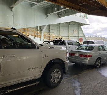 Photo of vehicles on car deck of ferry