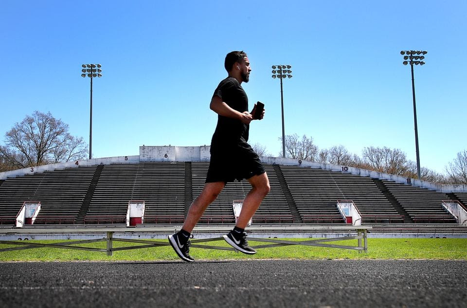 A runner ran laps on the track of White Stadium Tuesday.