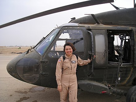 Senator Duckworth in front of helicopter in Iraq