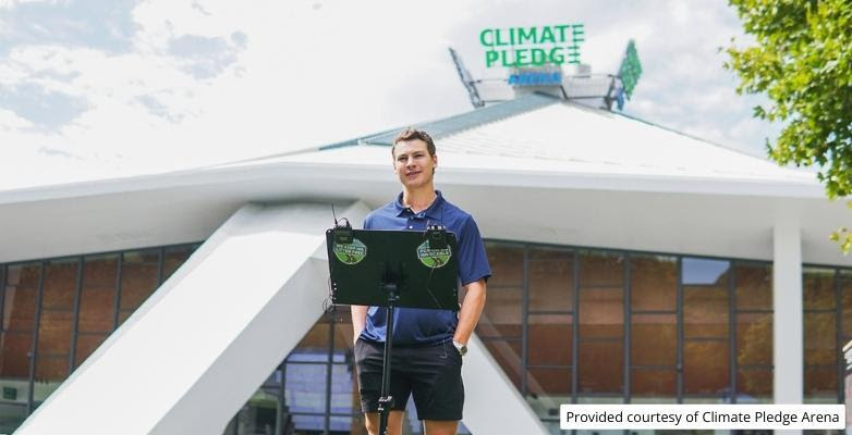 Professional hockey player Yanni Gourde talks to media about the We Keep WA Litter Free campaign outside the Climate Pledge Arena.