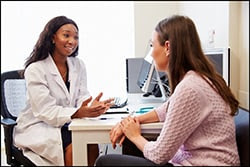 The figure above shows a health care provider counseling a woman. 