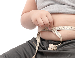 Child measuring his stomach
