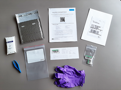 photo of the contents of a CWD mail-in testing kit with gloves, bags and documents to read and fill out