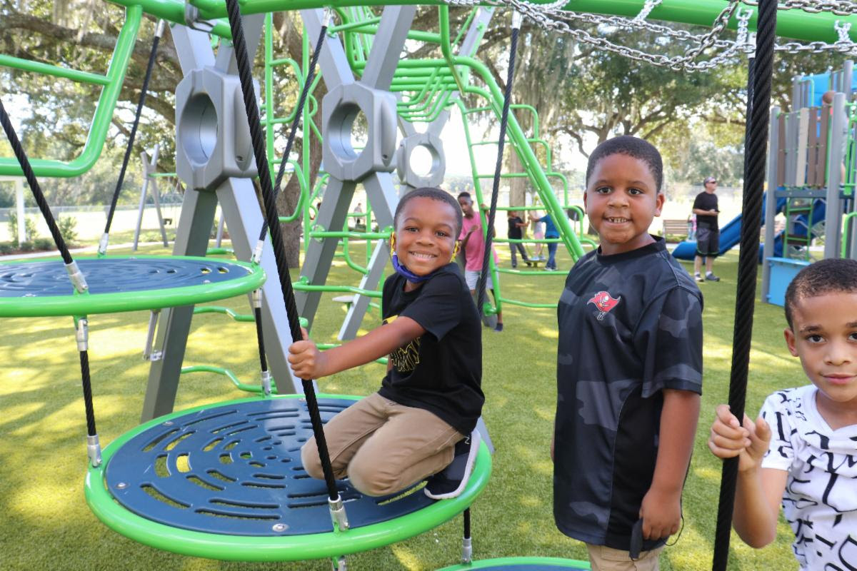 Mango Parks & Recreation Center kids on playground equipment