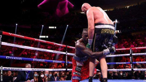 Tyson Fury knocks down Deontay Wilder for a second time