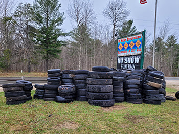 Stacked tires removed from state forest lands.