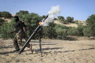 Palestinian Arab terror teens from the Democratic Front for the Liberation of Palestine (DFLP) fire a mortar shell during a military graduation ceremony in Rafah in southern Gaza.