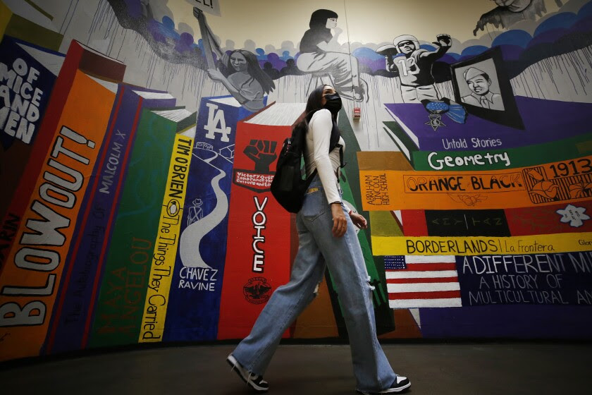 LOS ANGELES, CA - AUGUST 11: Abraham Lincoln High School Senior Tristan Gamboa as seniors are allowed to enter campus Wednesday morning to receive class selection, school ID, locker assignment and pick up books for classes. Tristan dreams of attending a Cal State University. She struggled to get good grades her freshman year, but was improving her sophomore year. When schools shut their doors in the spring that year, she stayed home as family and friends were sickened by COVID-19, finding it difficult to concentrate. LAUSD is planning to reopen in person instruction next Monday, August 16 with high safety standards and protocols at every campus for the 2021-22 school year. Abraham Lincoln High School on Wednesday, Aug. 11, 2021 in Los Angeles, CA. (Al Seib / Los Angeles Times).