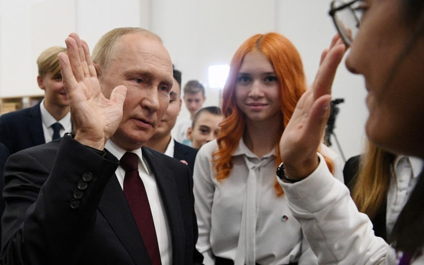 Putin high fives a student in Kaliningrad