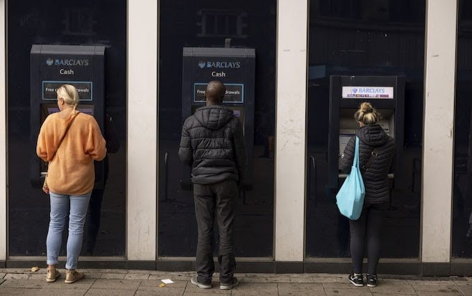 Customers withdraws money from ATMs