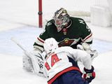 Washington Capitals&#39; Richard Panik (14), of Slovakia, scores a goal against Minnesota Wild goaltender Alex Stalock (32) during the first period of an NHL hockey game Sunday, March 1, 2020, in St. Paul, Minn. (AP Photo/Hannah Foslien)