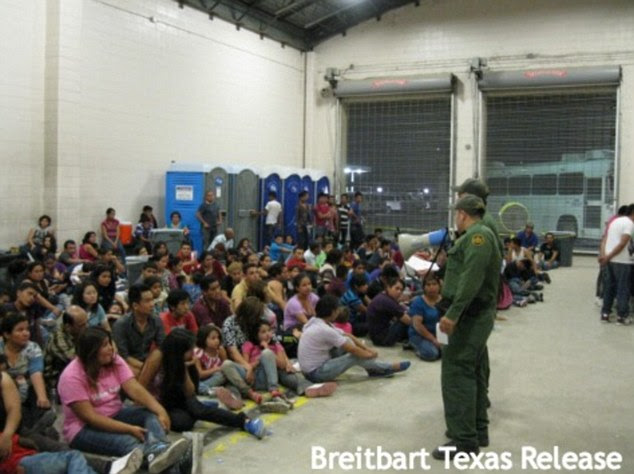 Hundreds of immigrants believed to be in the country illegally from Central America and Mexico being held in crowded concrete rooms similar to a jail cell