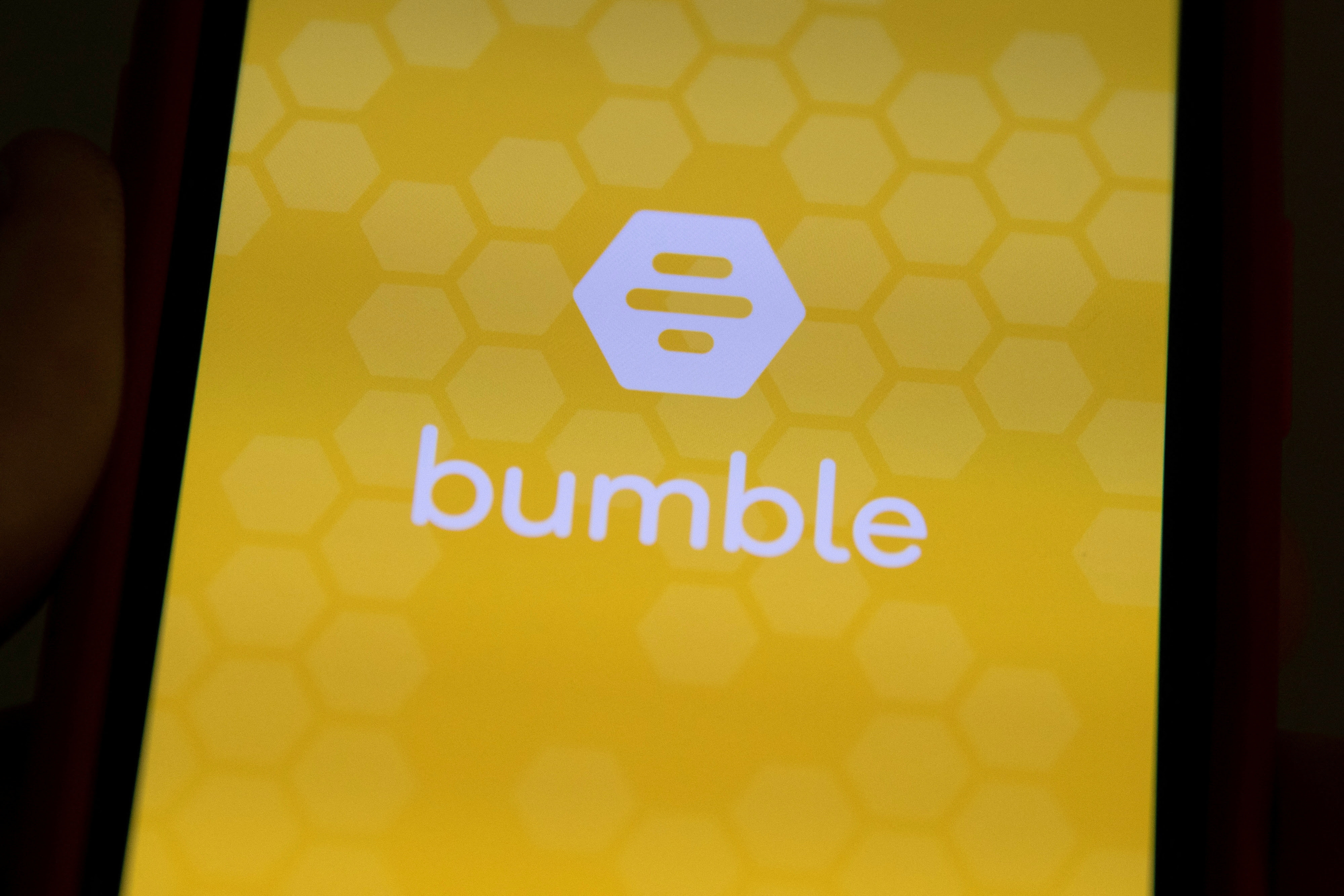 FILE PHOTO: The Bumble Inc. (BMBL) app is shown on an Apple iPhone in this photo illustration as the dating app operator made its debut IPO on the Nasdaq stock exchange February 11, 2021.       REUTERS/Mike Blake/Illustration/File Photo