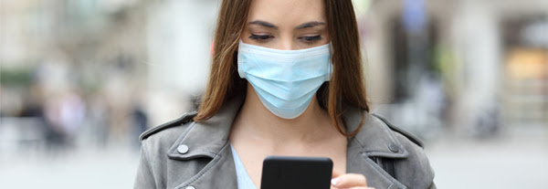 Couple wearing masks while walking outdoors
