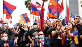 Armenians, their descendants and supporters rally to commemorate the 106th anniversary of the Armenian genocide in Los Angeles, California, yesterday.
