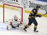 Buffalo Sabres forward Dominik Kahun (95) scores against Washington Capitals goalie Branden Holtby (70) during the shootout period of an NHL hockey game Monday, March 9, 2020, in Buffalo, N.Y. (AP Photo/Jeffrey T. Barnes)