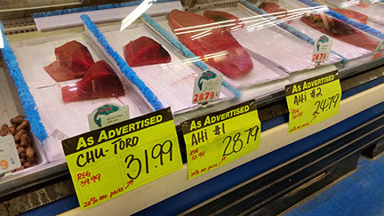 With limited supply during the closure, prices for bigeye tuna (ahi) skyrocketed at the Honolulu fish auction. At $13.70 a pound, this 214-pounder was worth nearly $3,000 off the boat.