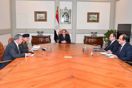 Slide 4 of 6: This photo released by Egypt's Presidency shows Abdel-Fattah El-Sissi, center, meeting with officials in Cairo after militants attacked a crowded mosque during Friday prayers in the Sinai Peninsula. The attackers set off explosives, spraying worshippers with gunfire and killing at least 184 people in the deadliest ever attack on Egyptian civilians by Islamic extremists. (Egyptian Presidency via AP)