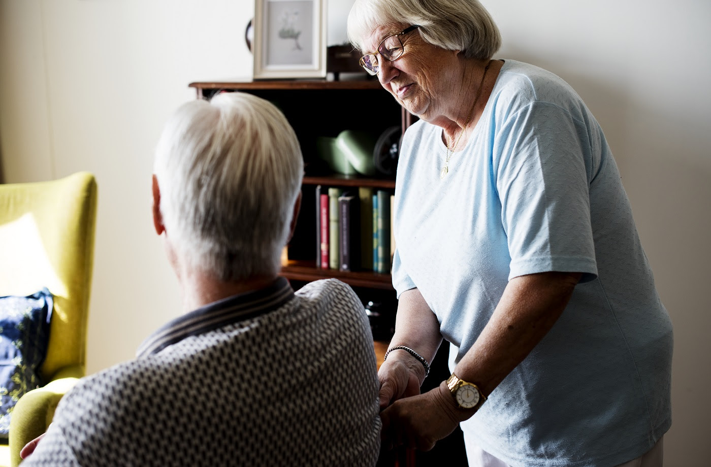 Senior Couple, Elderly Woman Taking Care Of An Elderly Man